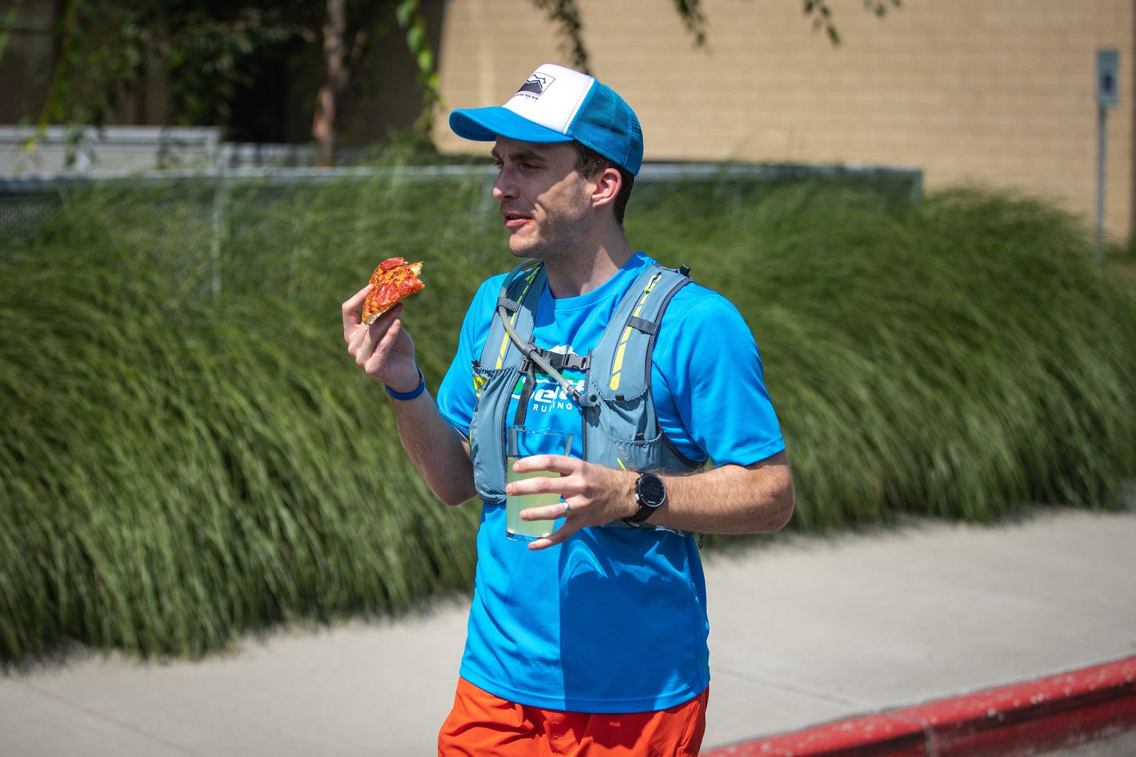 Bobby just after finishing with a piece of pizza in his hand